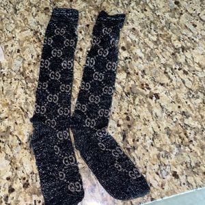 Gucci socks black with shiny on it worn once like brand new and 100 percent real